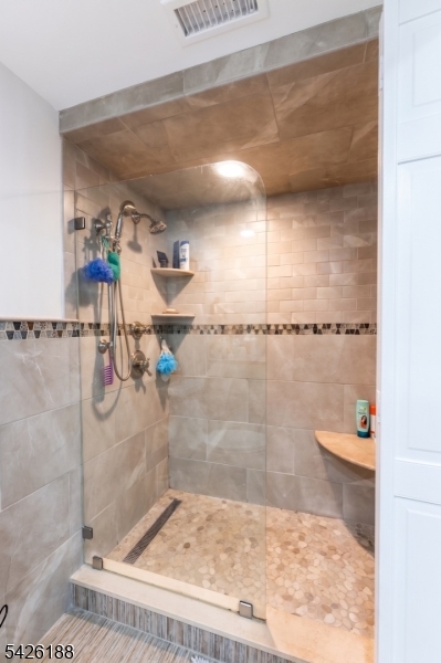 4 Millay Court Teaneck, NJ 07666 - Photo 9 of 32 a bathroom with a shower