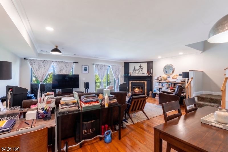 4 Millay Court Teaneck, NJ 07666 - Photo 10 of 32 a living room with furniture and a fireplace