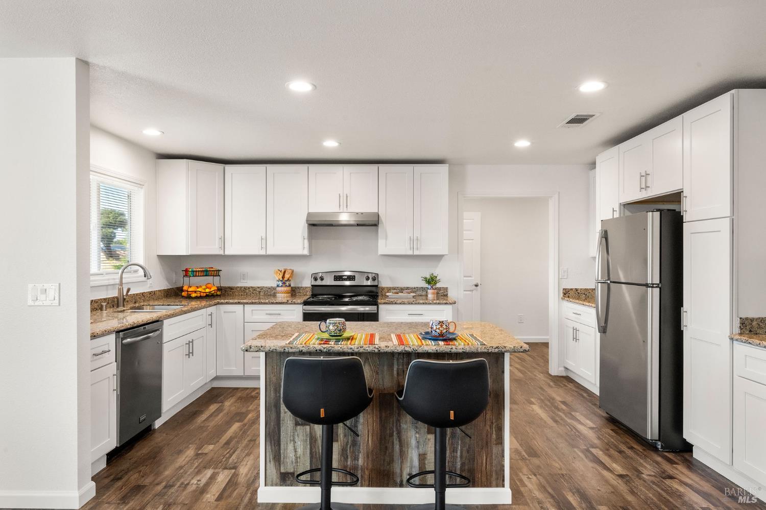 543 St Francis Way Rio Vista, CA 94571 - Photo 11 of 44 kitchen with white cabinets and stainless sink and stainless appliances