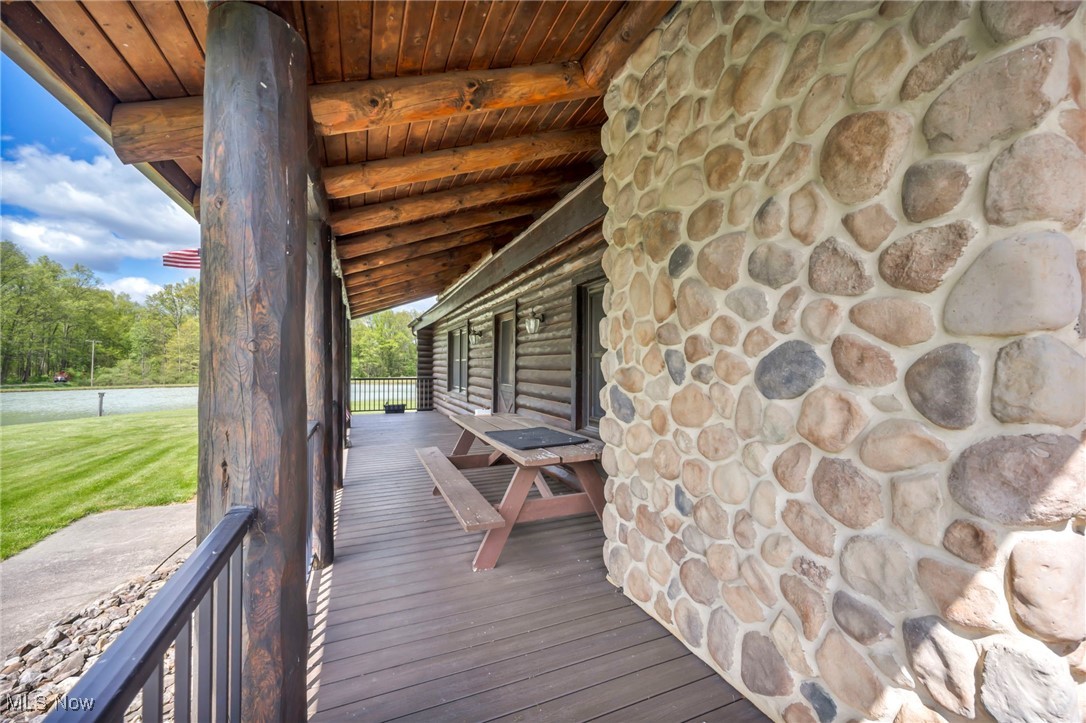 15180 Stoltz Road Diamond, OH 44412 - Photo 30 of 48 Wooden deck with covered porch