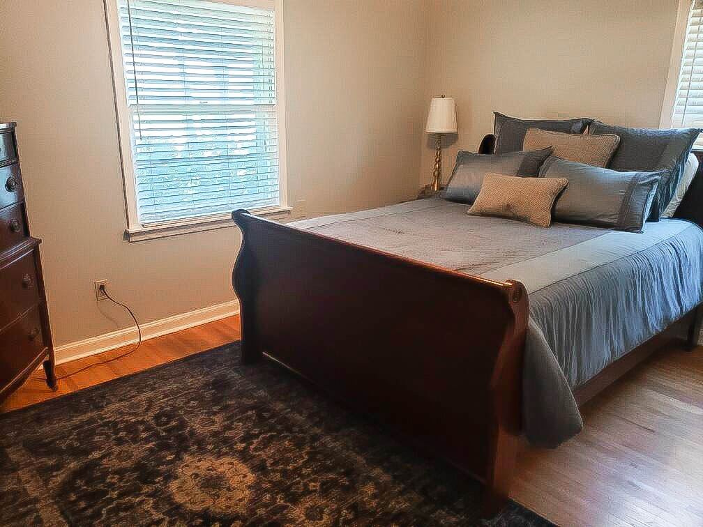 4856 Dee Road Memphis, TN 38117 - Photo 16 of 25 a bedroom with a bed and a window