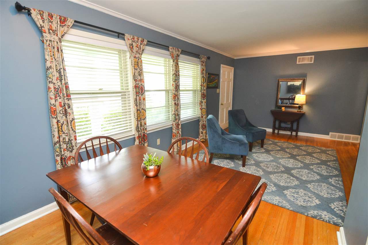 4856 Dee Road Memphis, TN 38117 - Photo 8 of 25 a dining room with furniture and wooden floor
