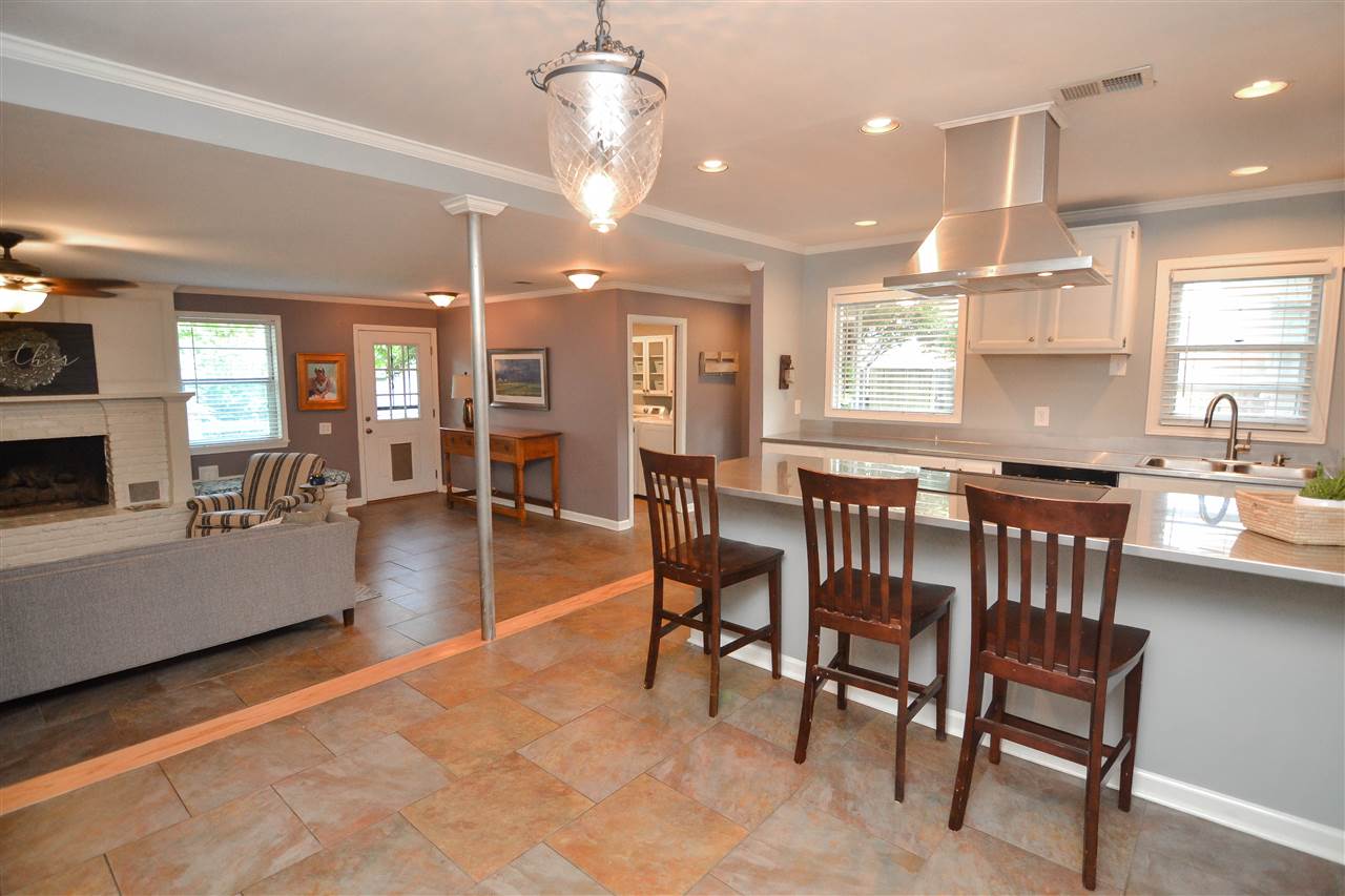 4856 Dee Road Memphis, TN 38117 - Photo 10 of 25 a view of a dining room with furniture window and wooden floor