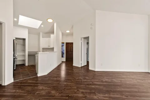 a kitchen with a refrigerator and cabinets