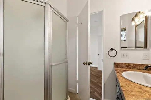 a view of kitchen and wooden floor