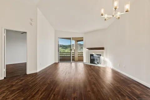 a view of a livingroom and a fireplace