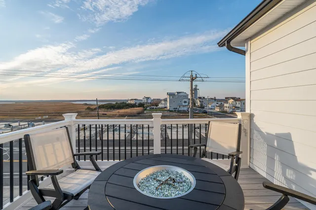 a view of a balcony with furniture