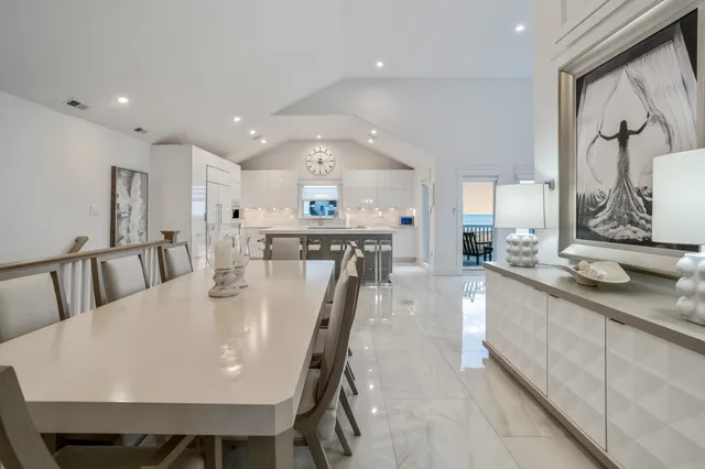 a large kitchen with a table and chairs
