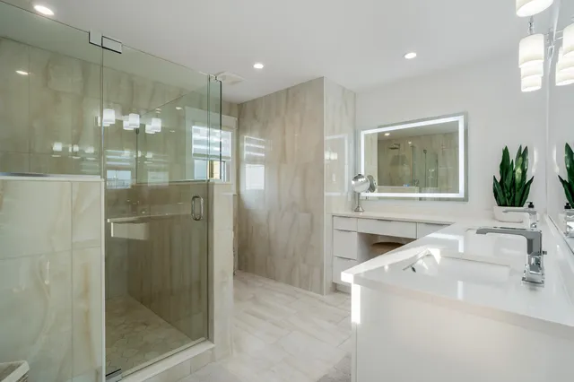 a bathroom with a sink and shower