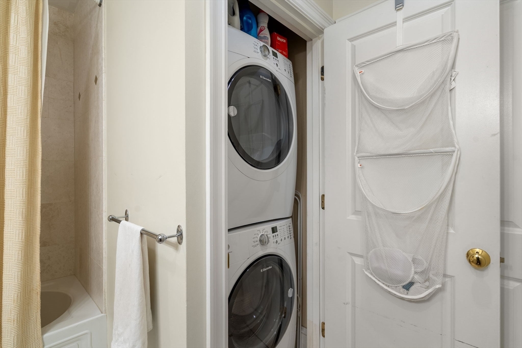 299 Marlborough Street, Unit 1 Boston, MA 02116 - Photo 12 of 15 a utility room with dryer and washer