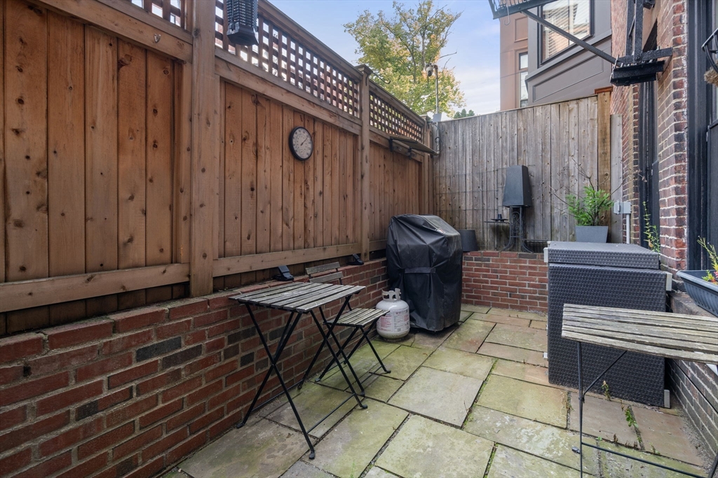 299 Marlborough Street, Unit 1 Boston, MA 02116 - Photo 14 of 15 a view of a chairs and table in the back yard of the house
