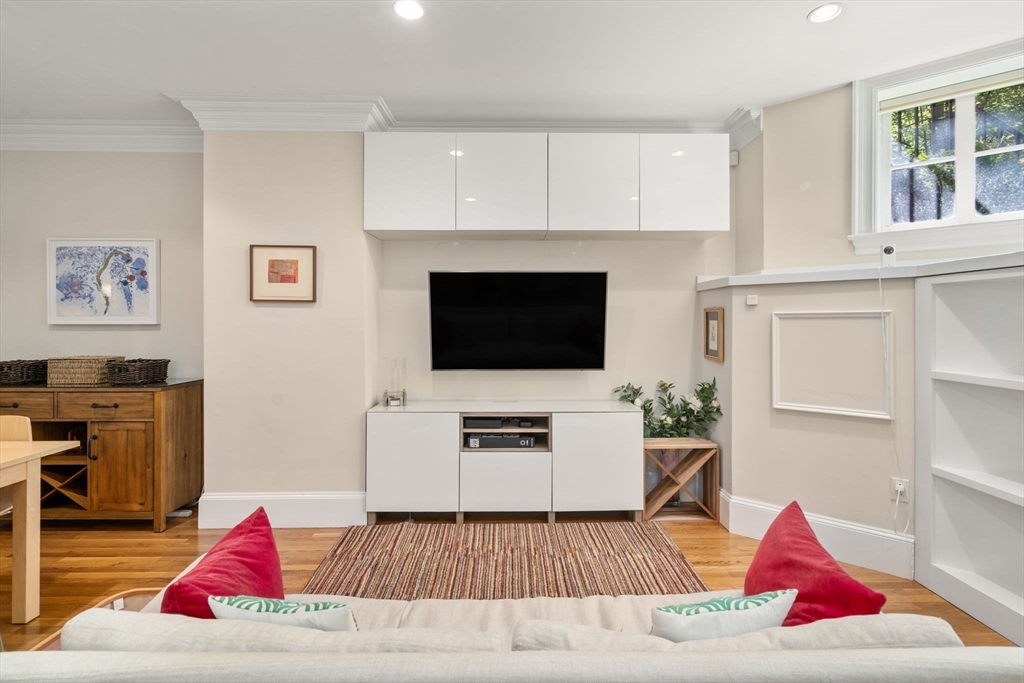299 Marlborough Street, Unit 1 Boston, MA 02116 - Photo 6 of 15 a living room with furniture and a flat screen tv