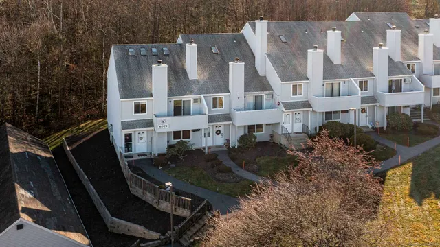 a aerial view of residential houses with outdoor space