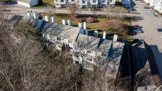 a view of a backyard both side of the house