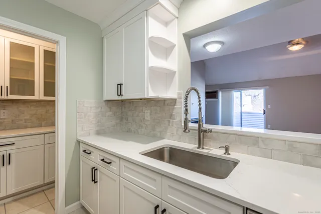 a kitchen with a sink and cabinets