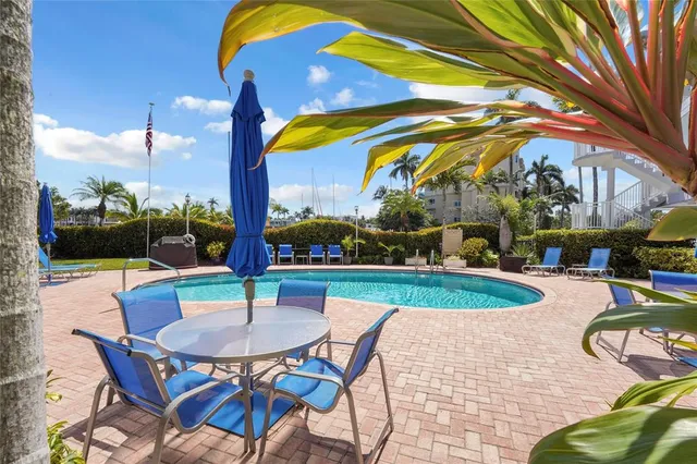 a view of swimming pool with outdoor seating