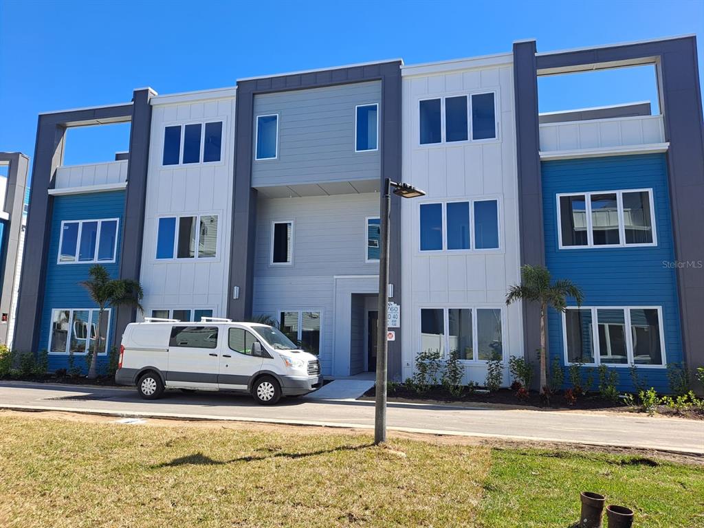 7760 Sandy Ridge Drive, Unit 124 Kissimmee, FL 34747 - Photo 1 of 1 a car parked in front of a building