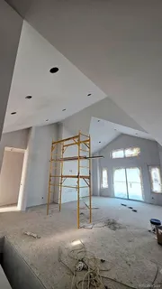 a view of a livingroom with furniture and windows