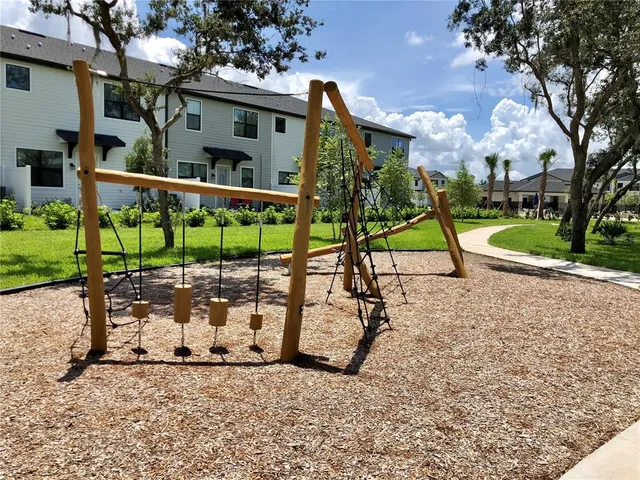 a view of a park with iron fence