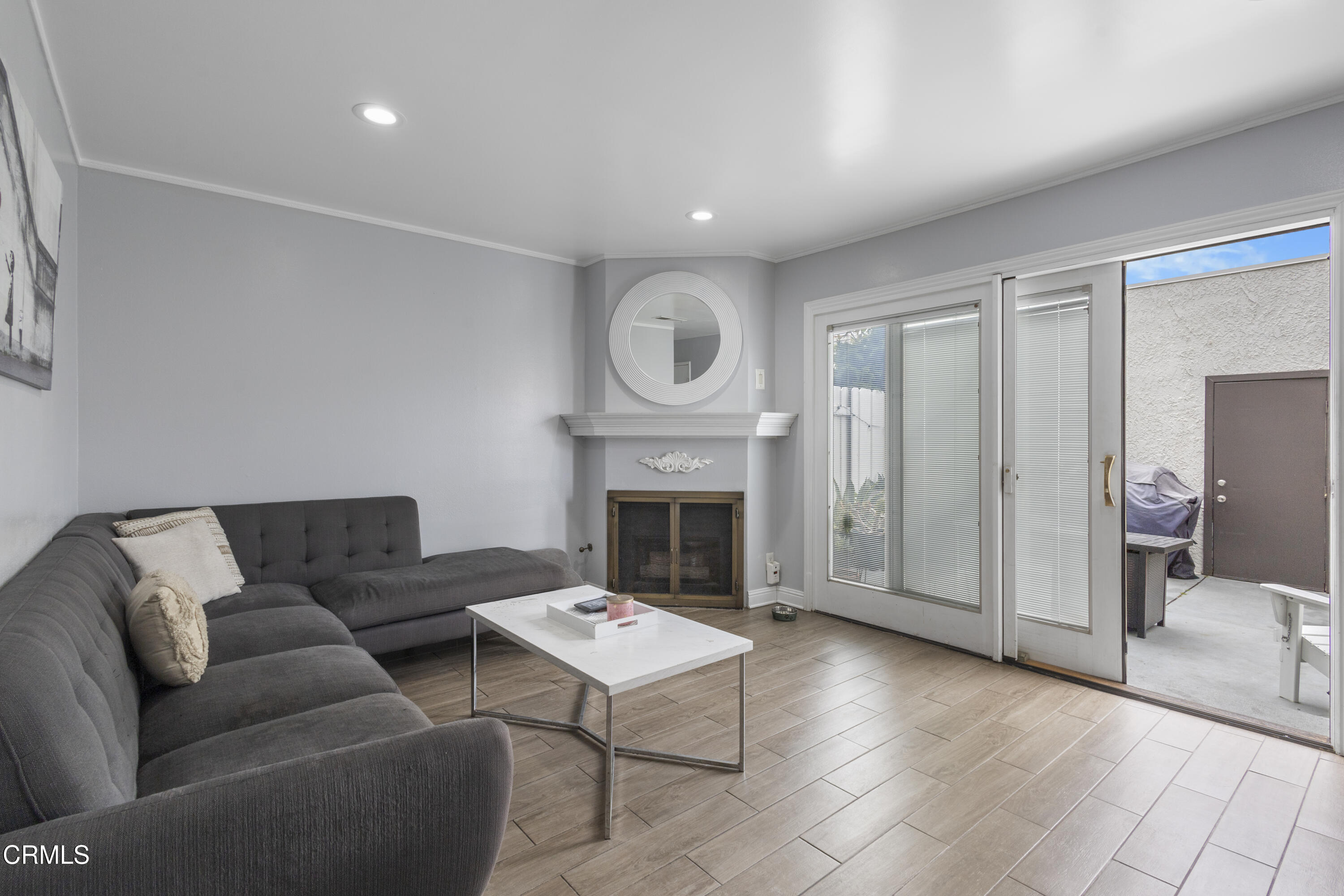 3235 Kelp Lane Oxnard, CA 93035 - Photo 12 of 22 a living room with furniture a fireplace and a flat screen tv