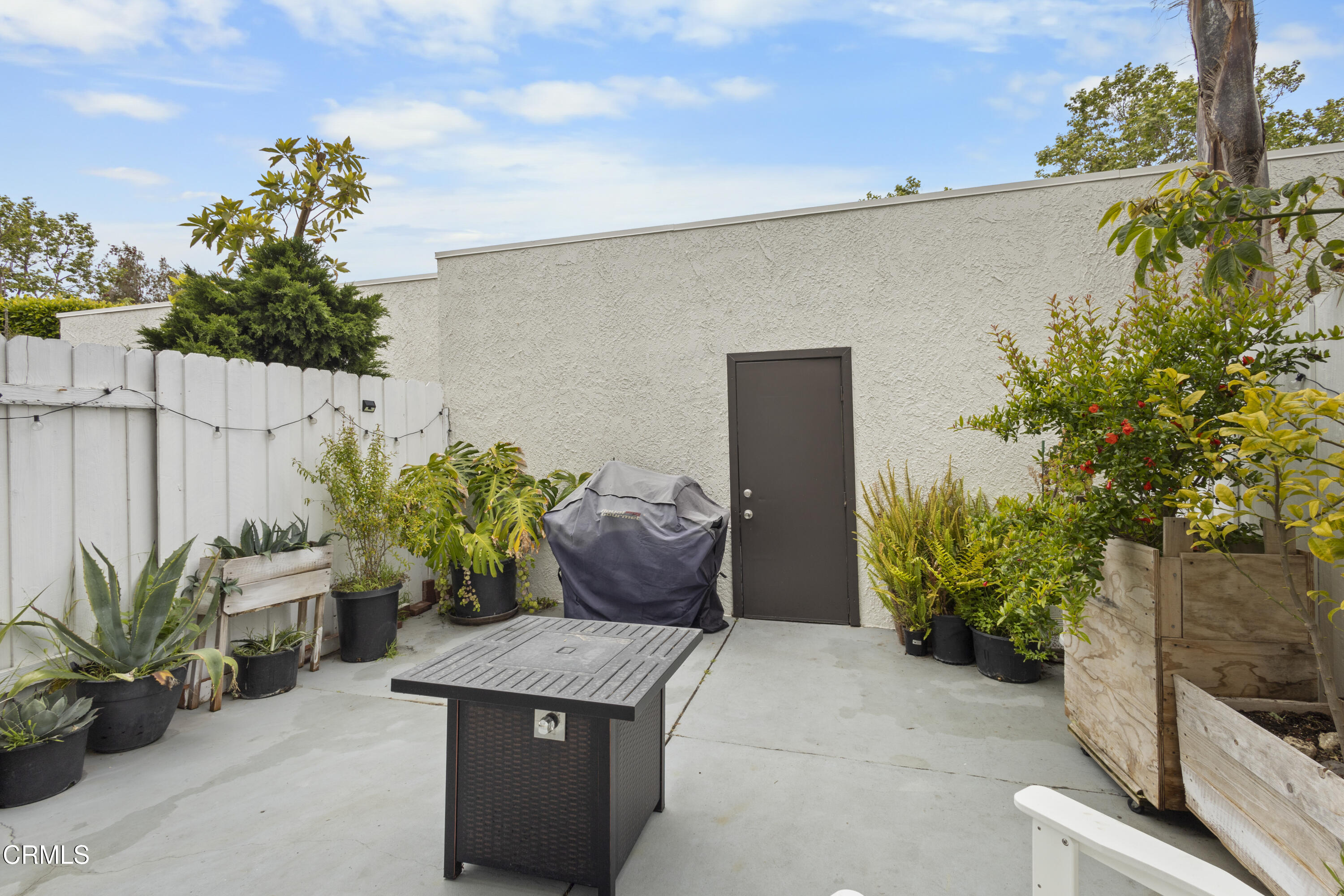3235 Kelp Lane Oxnard, CA 93035 - Photo 14 of 22 a wooden bench sitting in front of a building