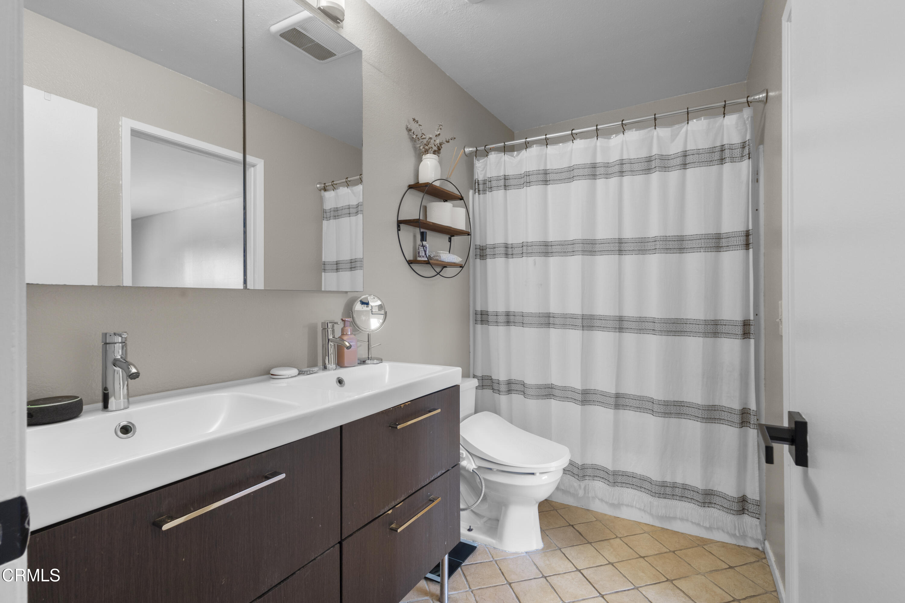 3235 Kelp Lane Oxnard, CA 93035 - Photo 20 of 22 a bathroom with a sink a toilet and shower