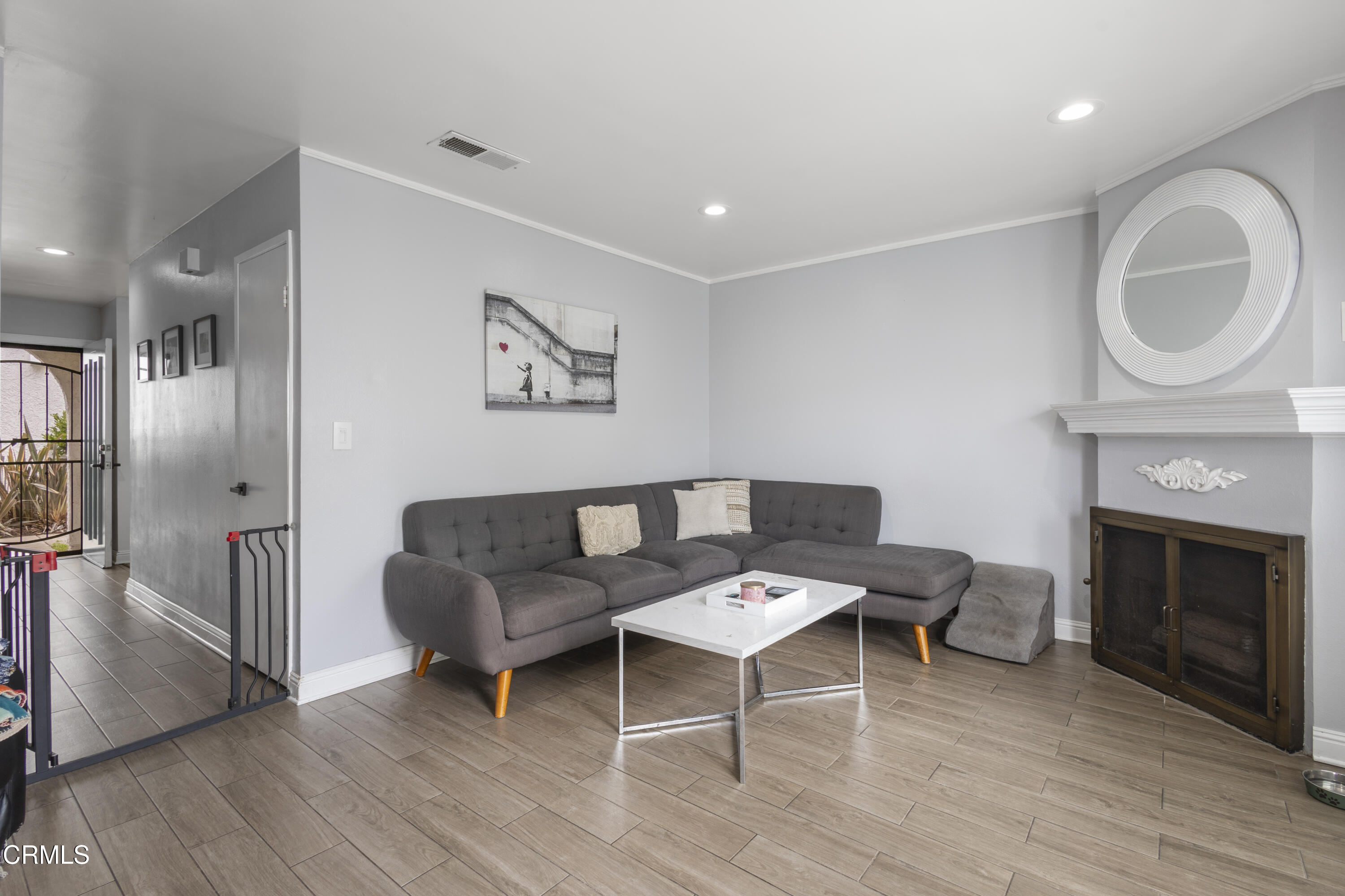 3235 Kelp Lane Oxnard, CA 93035 - Photo 10 of 22 a living room with furniture and a fireplace