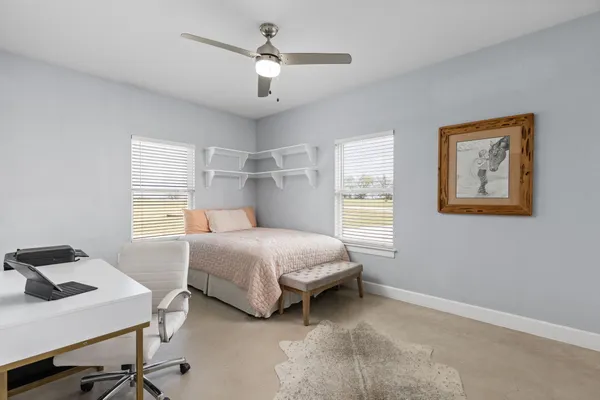 a spacious bathroom with a double vanity sink mirror and window