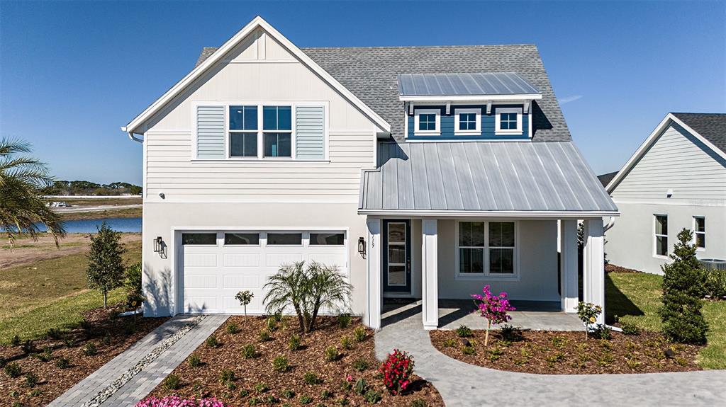 679 Maldives Trail Sarasota, FL 34234 - Photo 1 of 1 a front view of a house with garden