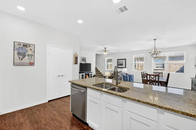 a kitchen with counter top space and sink