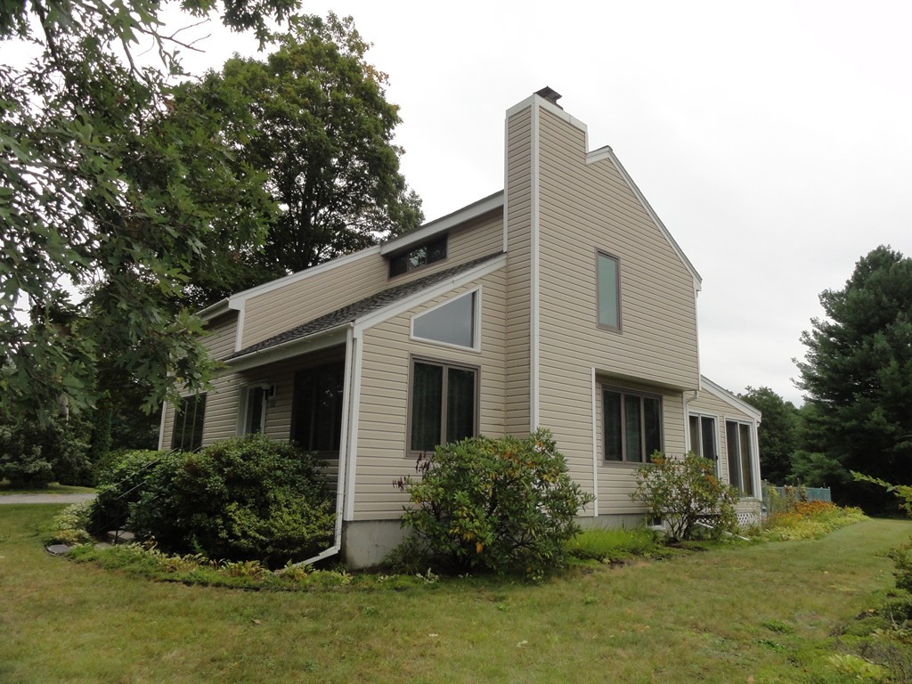 132 Groton Road Shirley, MA 01464 - Photo 3 of 29 a front view of a house with a yard