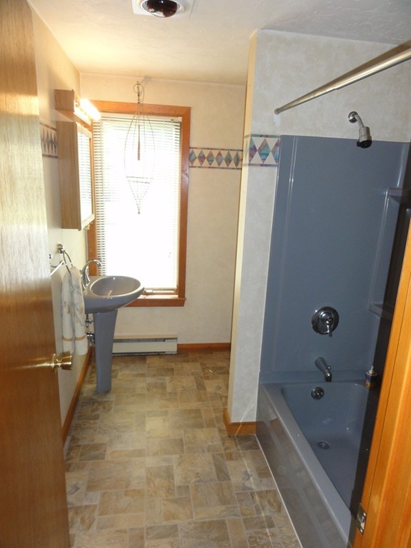 132 Groton Road Shirley, MA 01464 - Photo 5 of 29 a bathroom with a tub and a shower
