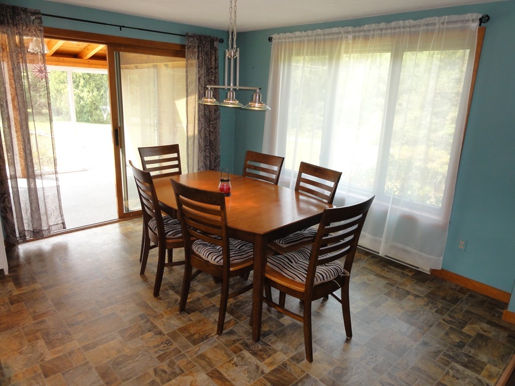 132 Groton Road Shirley, MA 01464 - Photo 9 of 29 a view of a dining room with furniture and a window