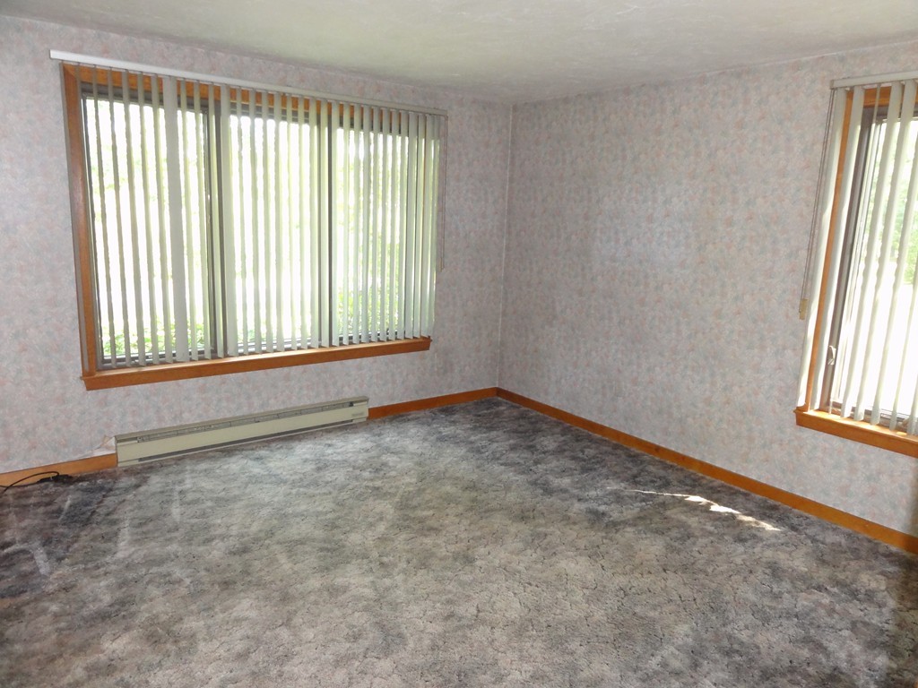 132 Groton Road Shirley, MA 01464 - Photo 10 of 29 a view of an empty room and window