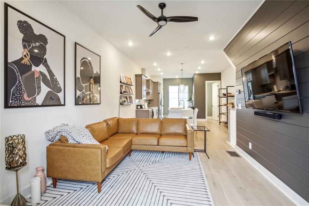 701 Pryor Street Southwest Atlanta, GA 30315 - Photo 1 of 1 a living room with furniture and a flat screen tv