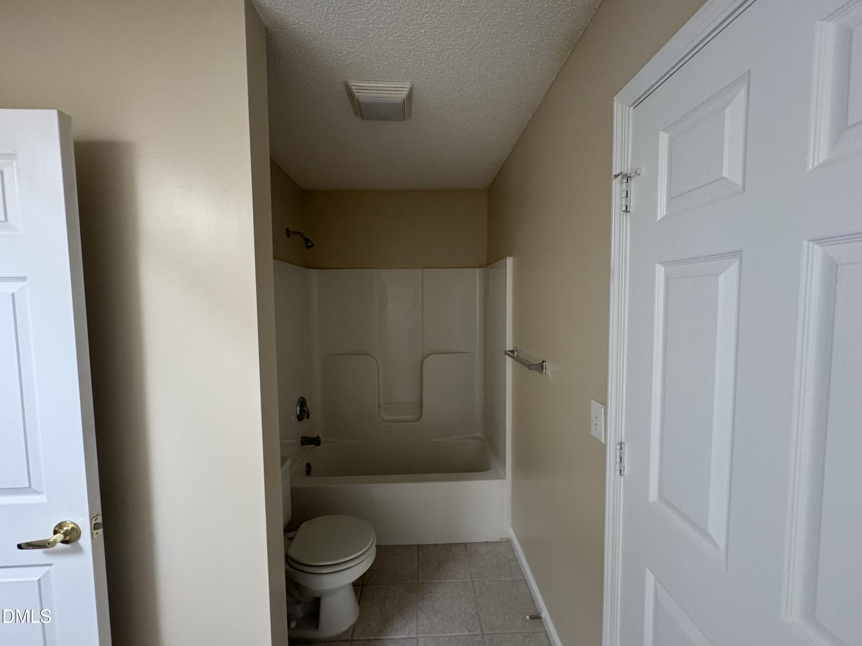 Undisclosed Address Raleigh, NC 27617 - Photo 10 of 22 a bathroom with a granite countertop toilet a sink and shower