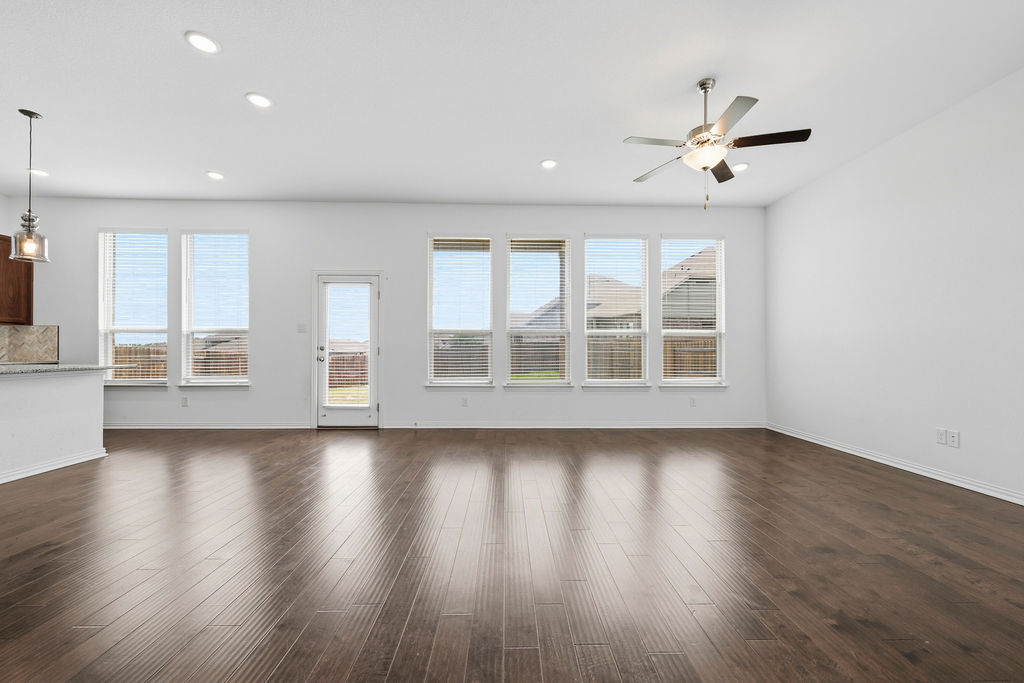 1005 Ridge Runner Drive Georgetown, TX 78628 - Photo 11 of 32 Spacious living area featuring wood-finish flooring, recessed lighting, and a ceiling fan
