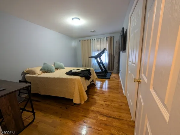 a bed room with a bed and a window