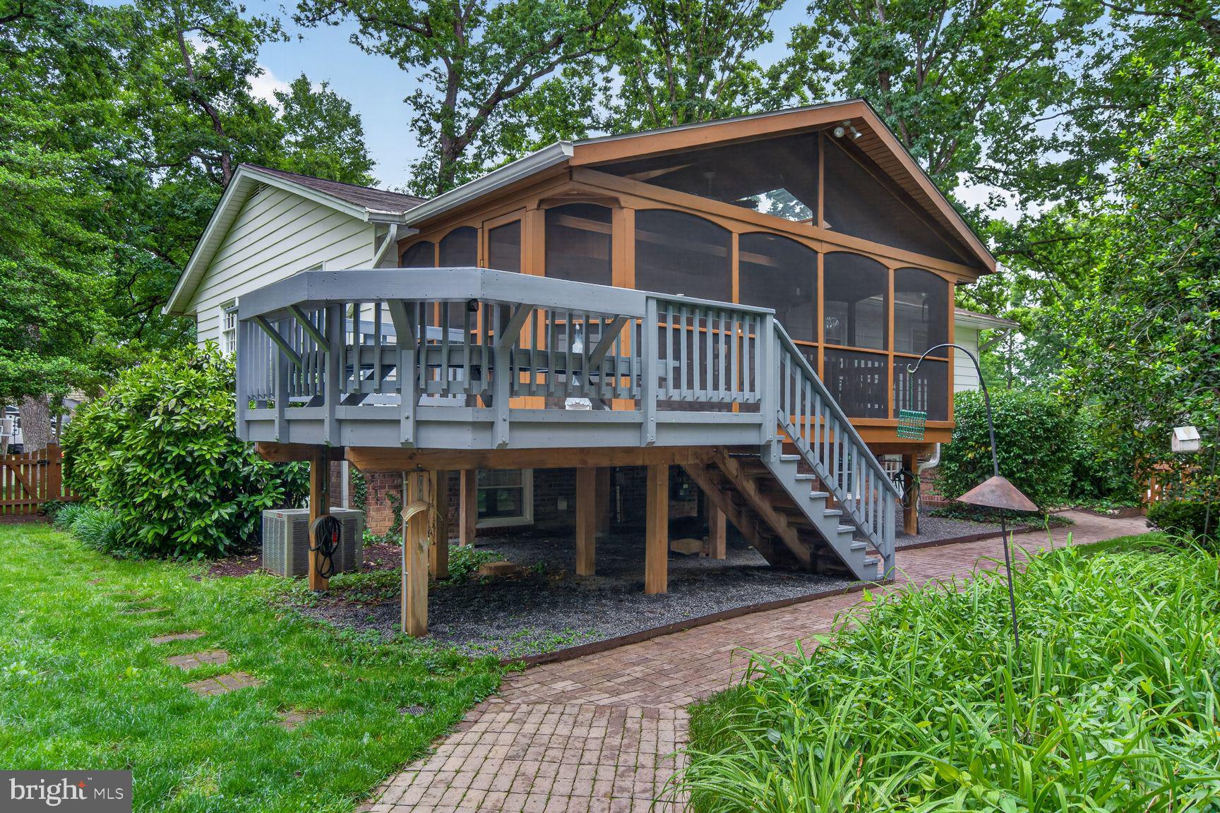 5024 Portsmouth Road Fairfax, VA 22032 - Photo 34 of 38 a view of a house with a yard and deck