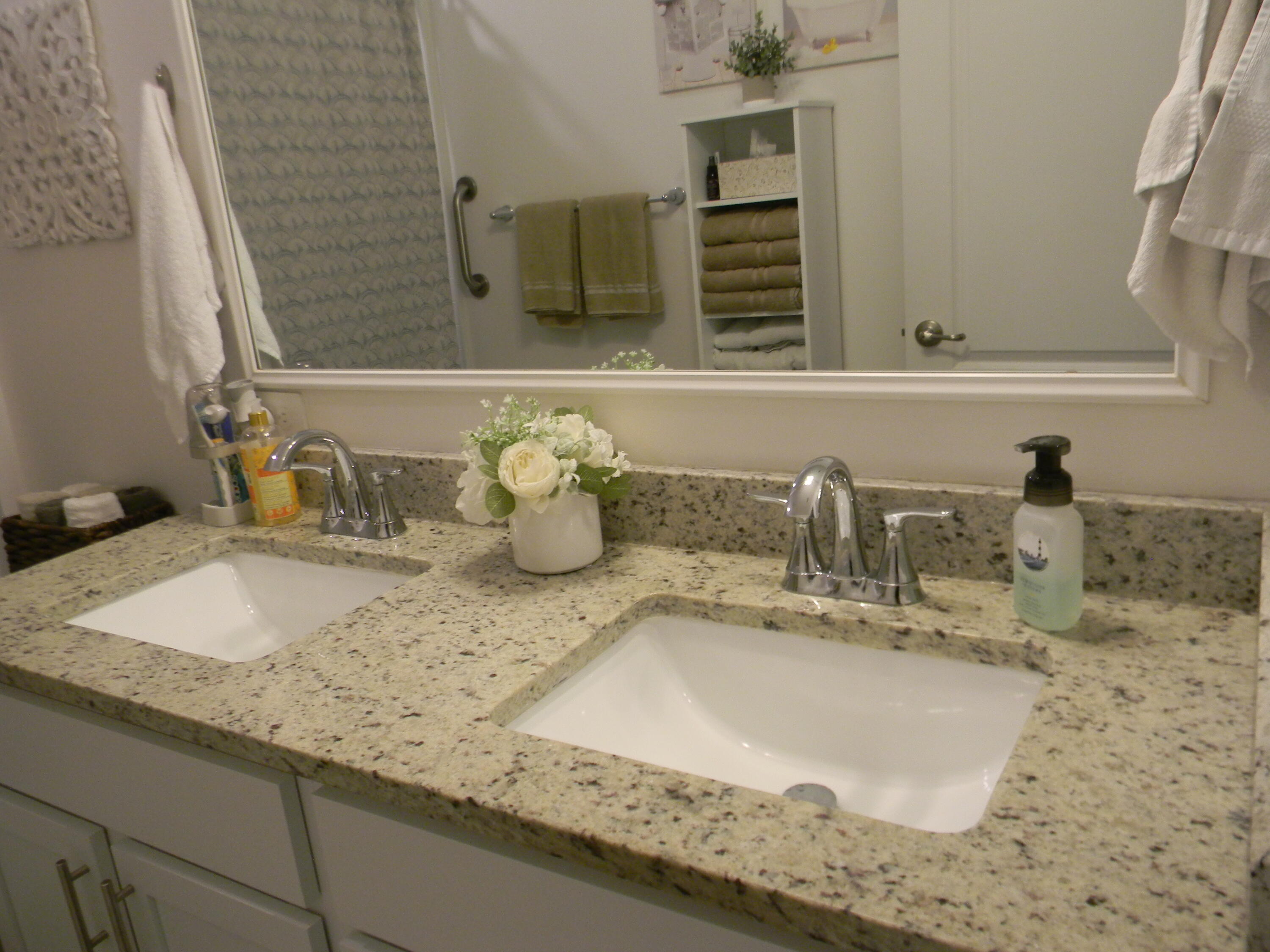 1588 Ranger Road Southeast Palm Bay, FL 32909 - Photo 24 of 52 a bathroom with a granite countertop sink and a mirror