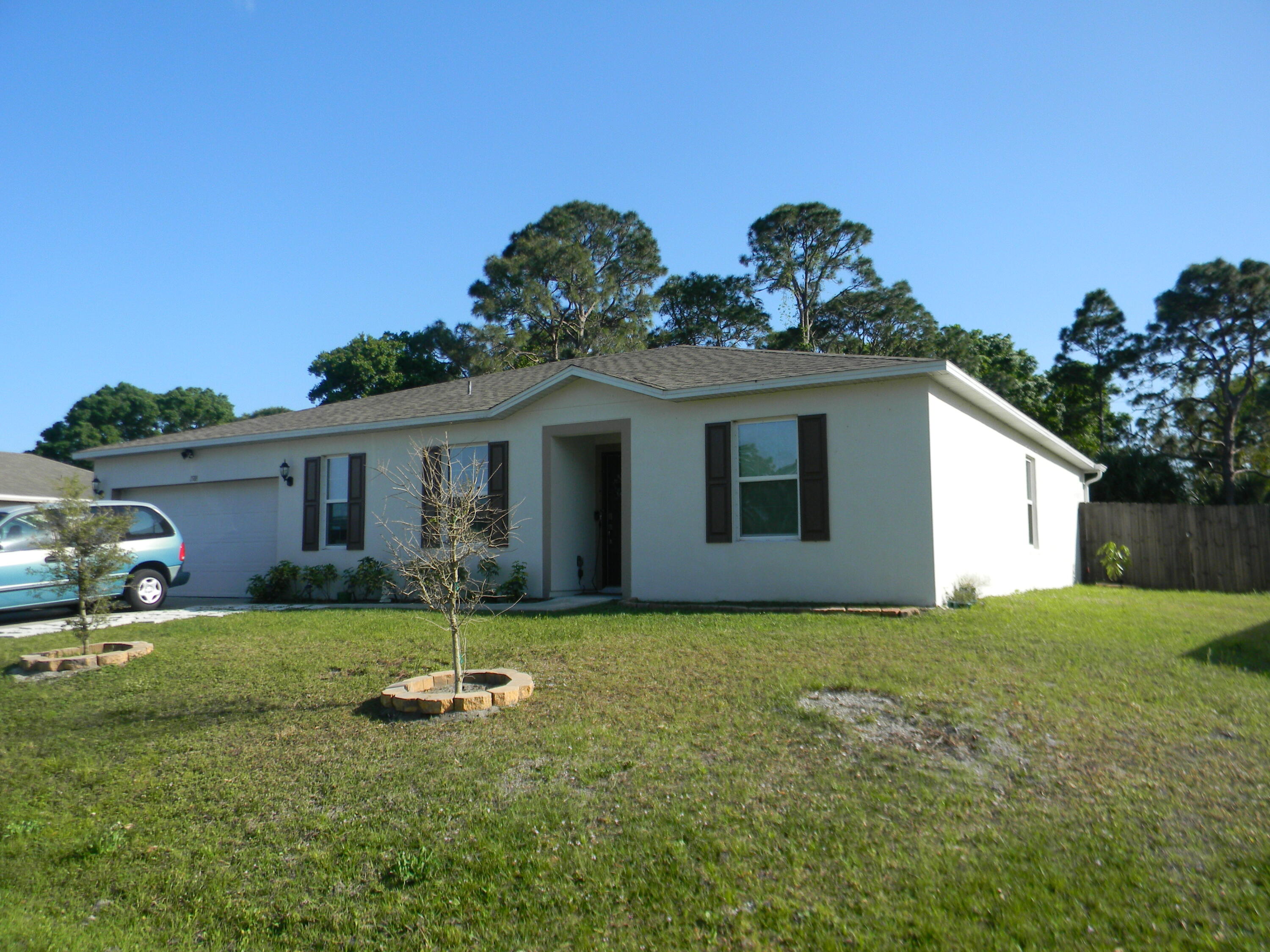 1588 Ranger Road Southeast Palm Bay, FL 32909 - Photo 3 of 52 a view of a house with a yard and a porch