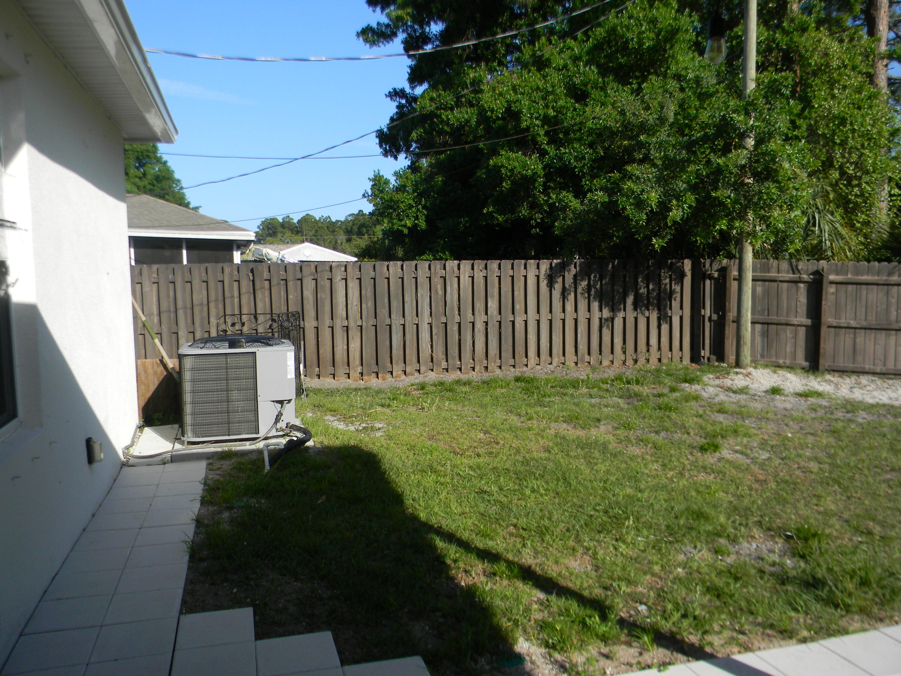 1588 Ranger Road Southeast Palm Bay, FL 32909 - Photo 43 of 52 a backyard of a house with lots of green space
