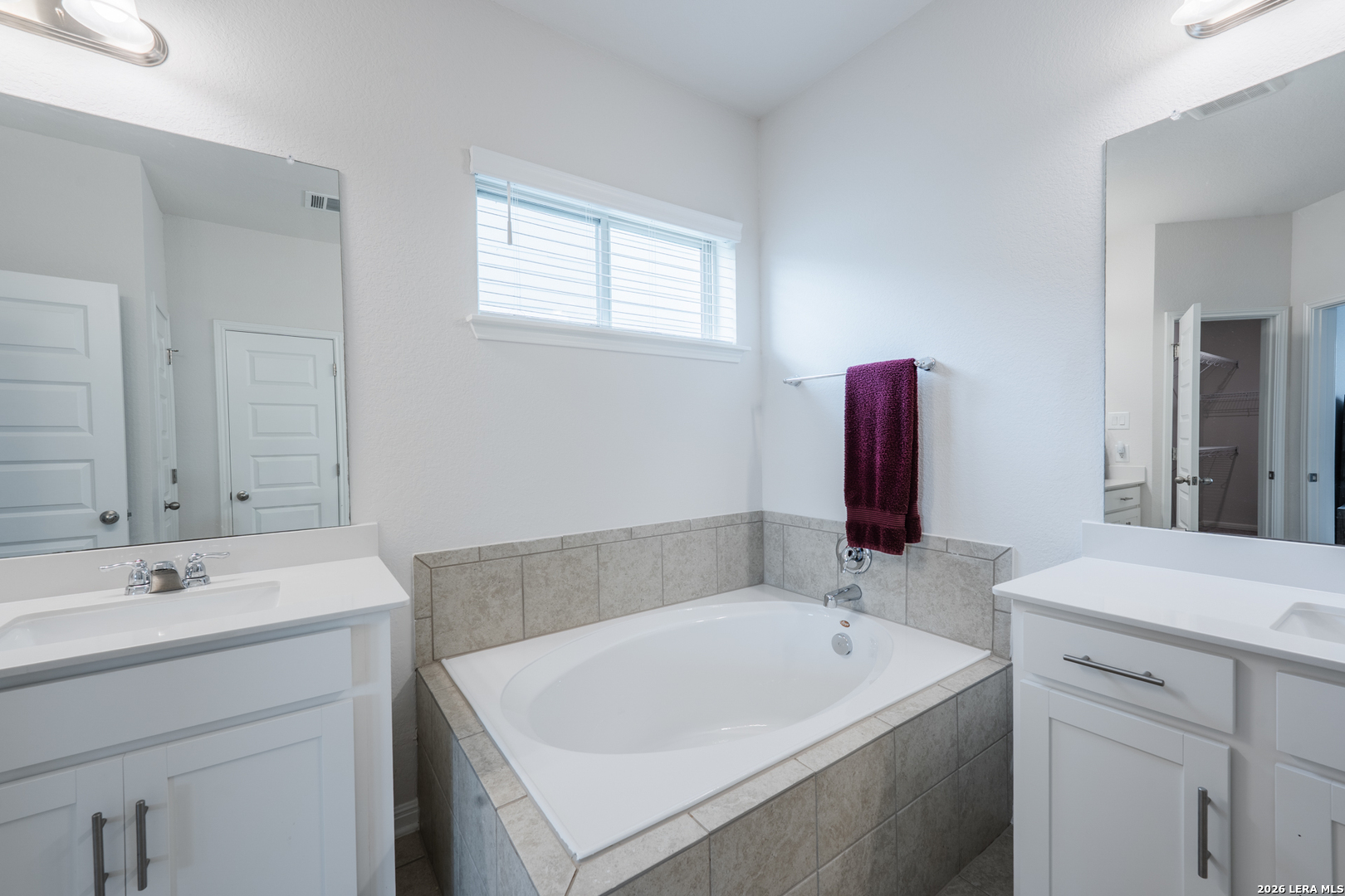 4947 Ranahan Pass St. Hedwig, TX 78152 - Photo 18 of 37 a bathroom with a sink and a bathtub