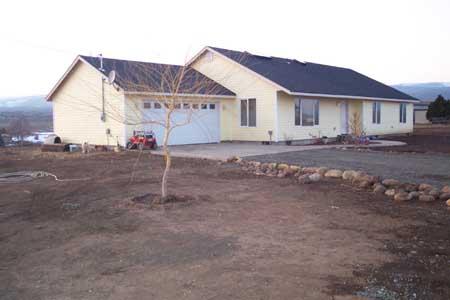 143 Slavin Heights Road Yakima, WA 98903 - Photo 1 of 15 a view of a house with a yard