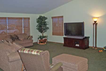 143 Slavin Heights Road Yakima, WA 98903 - Photo 4 of 15 a living room with furniture and a flat screen tv