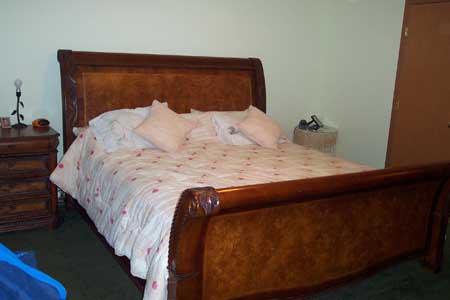 143 Slavin Heights Road Yakima, WA 98903 - Photo 7 of 15 a bed sitting in a bedroom next to a window