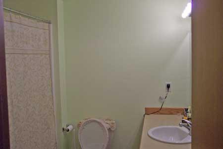 143 Slavin Heights Road Yakima, WA 98903 - Photo 8 of 15 a bathroom with a granite countertop sink and toilet