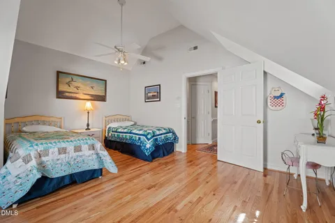 a bedroom with bed and window