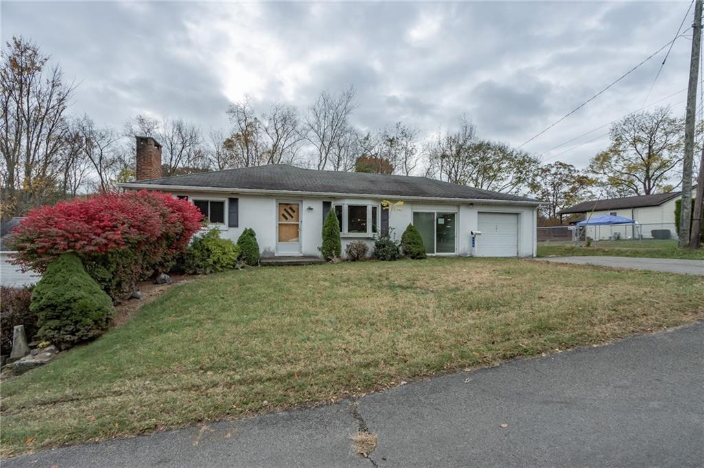 115 Acadia Lane Apollo, PA 15613 - Photo 2 of 20 a front view of a house with a garden