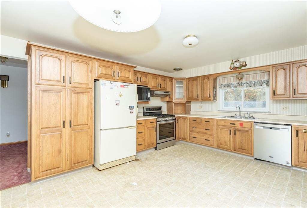 115 Acadia Lane Apollo, PA 15613 - Photo 9 of 20 a kitchen with granite countertop cabinets and refrigerator